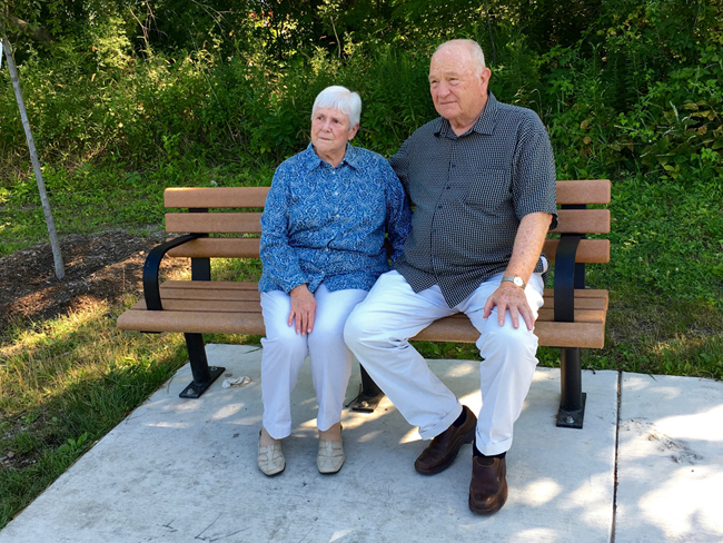 Judy and Dan Printz, Mary Ellyn's sister and brother-in-law, sit on “The Bench”