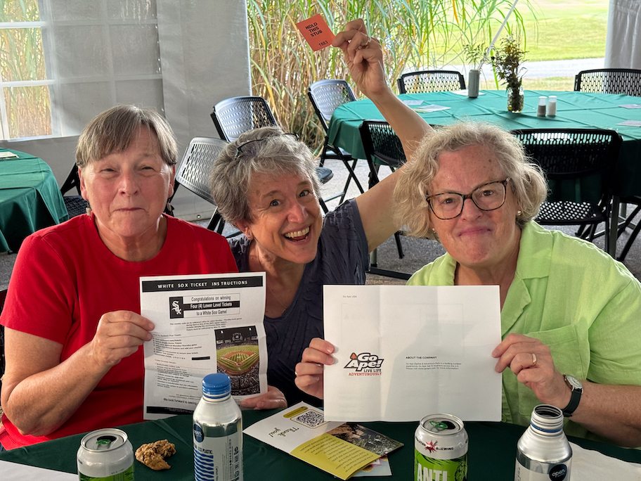 Loraine Edwalds, her wife Ruth Clark, and memorial donor Allison Downing each won a Buckets of Fun raffle prize. Allison gifted her win to Conservation Corps speaker Arianna Telles.