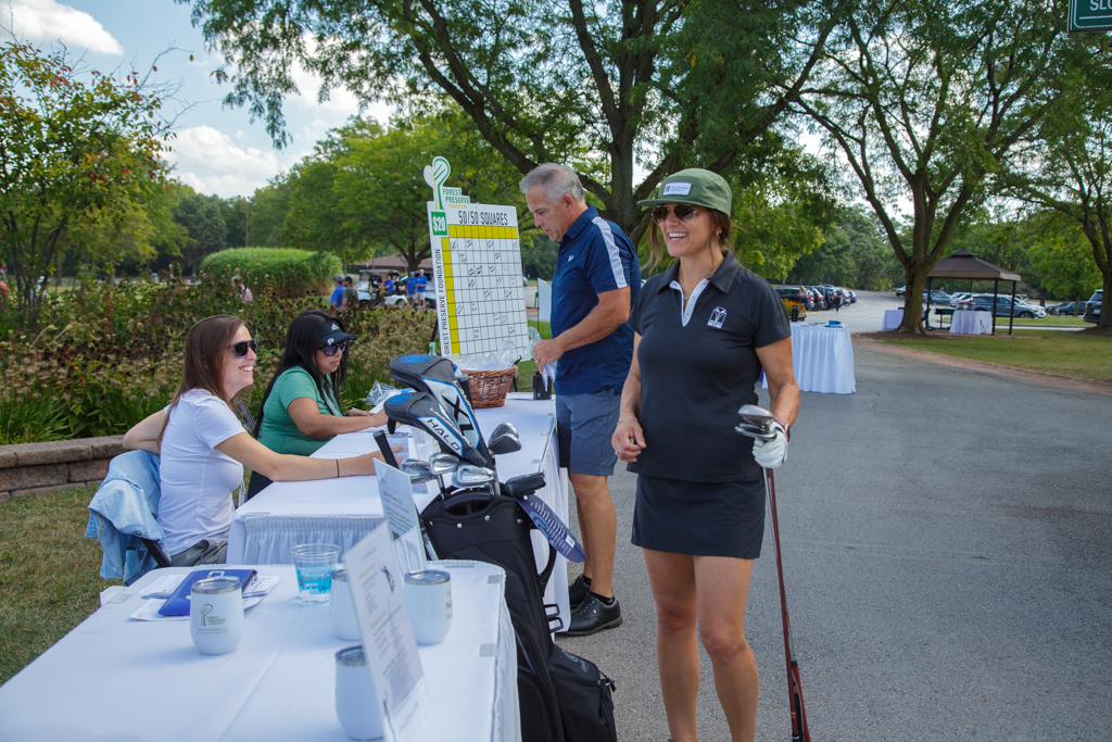 Development Director Erika Soria and Kristin Adams of Tallgrass Restoration and a CC24 committee member. check in Rebecca Olson of Olson Ecological Solutions. 